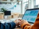 Find competitor pricing by analyzing business strategies with charts and a laptop in a workspace.