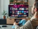 Experience a no credit card iptv trial with a relaxed user enjoying IPTV in a cozy setting.