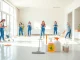 Efficient bond cleaning Brisbane in a bright apartment with professional cleaners showcasing teamwork.
