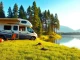 Explore a JRP Campers van parked at a beautiful lakeside, showcasing vibrant camping gear.
