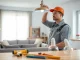 Electrician performing Electrical Service installation in a bright, modern living room.