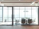 Showcase movable glass partitions in a modern office setting demonstrating flexibility and style.