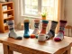 Showcasing vibrant 5 pairs mixed socks arranged on a rustic wooden table in a cozy setting.
