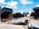 Bri-mar trailers for sale near me featuring a variety of models in a dealership with clear sky.
