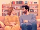 Couple actively communicating in relationships, showing empathy and connection in a cozy setting.