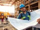 New York General Contractor managing a construction site with a team, showcasing professionalism and teamwork.